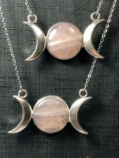 This gorgeous necklace features a generous cabochon of mellow pink rose quartz. It is framed by two crescent moons forming the symbol of the triple goddess, and has a pentacle on the back. It is hung on an 18" stainless steel chain (~20" once you include the moons) which I will shorten to your specifications at the time of purchase.  As with all natural stones, no two will be identical! Yours will be very similar to those pictured! You can see more of my triple moon goddess jewelry here: https://www.etsy.com/shop/CarnivorousThings?search_query=triple+moon All jewelry ships in a sturdy gift box, and will arrive ready for gift-giving. In Many cases, I can accommodate special or custom orders, simply message me, and I will do my best to help get you what you need, whether it's the perfect gif Moon Goddess Jewelry, Moon Goddess Necklace, Triple Moon Goddess, Goddess Jewelry, Wiccan Jewelry, Goddess Necklace, Perfect Gif, Triple Goddess, Triple Moon