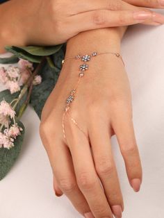 "14k gold hand chain/ Flower Hand Chain Ring Bracelet/ Link hand Chain/ Boho ring bracelet/ Rose Gold Finger Ring Bracelet/ Bridal Gift This will be your new favorite everyday bracelet. Super delicate, sparkly, and feminine. Wear it by itself, or mix and match it with our other Jewelry. This Bracelet would make a great gift for a family member, friend, or even yourself. Features * Made to Order *Gold KT: 14K Solid Gold *Gold Color: Available in Yellow, Rose or White Gold *Average Weight: 3.03gra Rose Gold Bracelet For Women Classy, Finger Ring Bracelet, Gold Hand Chain, Hand Jewelry Rings, Chain Ring Gold, Finger Bracelets, Gold Finger Rings, Hand Chain Bracelet, Ring Bracelet Chain