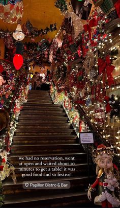 christmas decorations adorn the staircase leading to an event