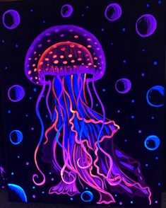 a jellyfish glows in the dark with blue and pink lights on it's body