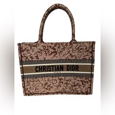 These Are Professional Pictures Of The Actual Item Offered By Mr. Goods. Brand New Never Been Used No Box No Dustbag No Major Flaws No Signs Of Use Size Length: 14.00 In Height: 10.75 In Width: 6.25 In Drop: 6.00 In This Is An Authentic Christian Dior Canvas Embroidered Medium Brocart Book Tote In Metallic Pink. His Colorful Tote Is Finely Crafted Of Embroidered Canvas In Pink. The Bag Features Matching Canvas Rolled Handles, With The Christian Dior Logo Embroidered Across The Front. The Bag Ope Elegant Shopping Bag With Embroidered Logo, Elegant Shopping Bags With Embroidered Logo, Luxury Bags With Embroidered Logo For Shopping, Designer Rectangular Bag With Embroidered Logo, Brown Bags With Embroidered Logo For Shopping, Designer Bags With Embroidered Logo For Shopping, Designer Shopping Bag With Embroidered Logo, Designer Embroidered Shopping Bag, Designer Embroidered Bags For Shopping