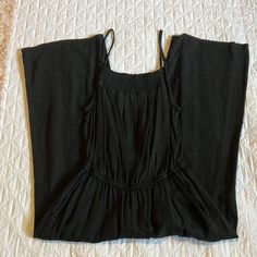 Worn A Handful Of Times, Washed Cold And Hung To Dry. This Jumpsuit Is Soft And Extremely Comfy - It No Longer Fits Me, So It Needs A New Home! Still Looks Brand New - No Signs Of Wear Or Fading. Measurements Were Taking While Laying Flat. Black Fabric That Has A Linen-Feel. Has A Cropped/Ankle Cut (I’m 5’9 And It Hits Above My Ankle). Elastic Waist And Also Has An Elastic “Cinch” At The Top. Functional Pockets And Adjustable Straps! Black Cotton Jumpsuit For Summer, Black Maxi Length Casual Jumpsuits And Rompers, Black Maxi Jumpsuits For Vacation, Black Overall Jumpsuits And Rompers For Vacation, Black Stretch Cotton Jumpsuits And Rompers, Black Jumpsuits And Rompers With Elastic Waistband For Spring, Fitted Black Cotton Jumpsuits And Rompers, Black Elastic Waistband Jumpsuits For Spring, Fitted Black Jumpsuits And Rompers For Vacation