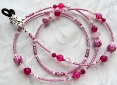 CJ's Inspirations "Pink Rose" This beautiful eyeglass lanyard was made with a collection of Dragon's Vein Agate gemstones, Rose Jade gemstones, and Lampwork beads, Crackle Glass beads with sparkling crystals. It makes a wonderful addition to your lanyard collection or a great gift for others. Features and Options: NEW: This eyeglass lanyard can also be converted to a mask lanyard so you never have to set your mask down when you're eating or need a break. The lanyard is connected using small jump Pink Glass Beaded Necklaces For Gift, Pink Glass Beaded Necklace For Gift, Handmade Adjustable Pink Glasses Chains, Adjustable Pink Glasses Chains As Gift, Adjustable Pink Glass Glasses Chains, Handmade Pink Glass Glasses Chains, Lanyard Pink, Beaded Eyeglass Chain, Rose Mask