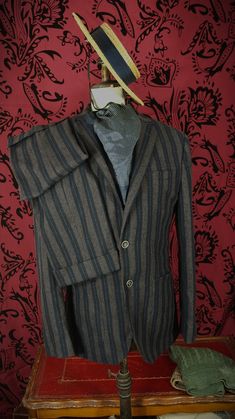 More items at www.newfanglednatty.com A good quality Italian suit by a well respected and expensive tailor. The suit is in an interesting unusual style , with the turn upped and pleated trousers and striped cloth. Looks rather vintage European in style. Half lined jacket. Lovely tailoring , design and materials as you would expect from a vintage Aquascutum suit. RRP £695  -   Label says 44 R.  Fits as a 42 inch large slimmer 44 inch large, 36 inch  waist and 31 inside leg . See measurements below. Condition: Very light use. . Approximate sizes when laid flat Please check the measurements to a similar garment that you own to ensure a good fit.    Underarm to underarm:- 23"     Middle across jacket waist:- 21 3/4"                                           Underarm to hem:- 20 " Fitted Flat Front Suit For Fall, Winter Fitted Three-piece Suit For Formal Occasions, Fitted Winter Sets With Pockets, Fitted Full Length Sets For Fall, Fitted Winter Suits With Welt Pockets, Classic Fitted Three-piece Suit For Winter, Fitted Winter Suits For Tailoring, Classic Fitted Three-piece Winter Suit, Fitted Single Button Winter Suit