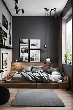 a bedroom with black walls and wooden floors is pictured in this image, there are pictures on the wall above the bed