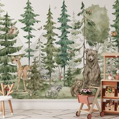 an animal themed wallpaper in a children's room with animals and trees on it