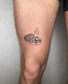 a man with a tattoo on his leg