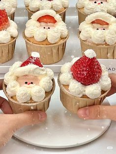 santa clause cupcakes with strawberries on top