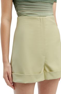 A flat front details these cuffed shorts topped with a high waist and finished with back pockets. 2 1/2" inseam; 25 1/2" leg opening; 12 3/4" front rise; 17" back rise Zip fly with hook-and-bar closure Back welt pockets Partially lined 97% polyester, 3% elastane Hand wash, line dry Imported Spring High-waisted Bermuda Shorts With Built-in Shorts, Spring High-waisted Bermuda Shorts With Belt Loops, High-waisted Bermuda Shorts With Belt Loops For Summer, Spring Knee-length Shorts With Belt Loops, Fitted Bermuda Shorts With Belt Loops For Summer, Chic Fitted High Waist Bermuda Shorts, Classic High-waisted Shorts With Belt Loops, Spring Bermuda Shorts With Rolled Hem, Fitted Bermuda Shorts With Belt Loops For Spring