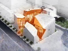 an aerial view of a building with orange panels