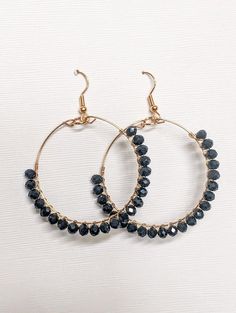 Make a statement with our Beautiful Black Beaded Hoop Earrings. These chic hoops blend timeless style with modern flair, adding a touch of sophistication to any outfit effortlessly. Measures 1.75 Book Jewelry, Yellow Earrings, Beaded Hoop Earrings, Holiday Jewelry, Beaded Hoops, Wood Earrings, Leather Necklace, Silver Turquoise, Black Beads