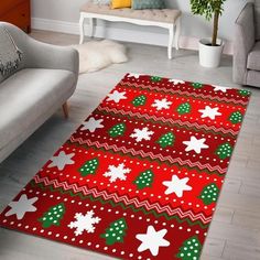 a red and green christmas rug with snowflakes on it in a living room