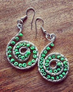 Welcome to AngelFairytale's world! These spiral earrings are made with 14 gauge aluminum wire. Wrapped and decorated with green beads with hypoallergenic earring hooks, with clear rubber earring backs. A beautiful gift for yourself or a friend... for a birthday gift, or a special occasion! Bohemian Spiral Wrap Earrings With Ear Wire, Bohemian Multicolor Wire Wrapped Beaded Earrings, Handmade Bohemian Spiral Earrings, Turquoise Bohemian Earrings With Ear Wire, Bohemian Spiral Nickel-free Hoop Earrings, Spiral Earrings, Hypoallergenic Earrings, Green Bead, Earring Backs