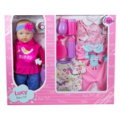 a baby doll in a pink box with clothes and accessories