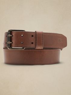 Luxury at first sight, this sturdy leather belts puts a spin on a timeless original with a double-pronged buckle.  LEATHER WORKING GROUP: By purchasing this product, you are supporting responsible leather manufacturing through the Leather Working Gro Leather Belt Buckle With Removable Belt For Everyday Use, Leather Belt Buckles With Removable Belt For Everyday Use, Rugged Belt Buckles With Leather Strap For Everyday Use, Rugged Leather Belt Buckles For Everyday Use, Rugged Leather Belt Buckles With Leather Strap, Rugged Leather Belt Buckles With Strap, Rugged Leather Belt With Removable Feature, Rugged Leather Belt Buckles, Rugged Leather Belt