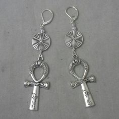 "Beautiful handmade earrings made with high quality silver plated metal Ankh symbol, with nickel free silver plated leverback earwires Lightweight and easy to wear, these earrings are 4\" long. Please come back and visit to check for more unique new designs and styles For more styles visit my Etsy shop:www.etsy.com/shop/SoftlySisterDesigns" Silver Symbolic Earrings For Jewelry Making, Symbolic Silver Earrings With Ear Wire, Silver Symbolic Hypoallergenic Earrings, Silver Hypoallergenic Symbolic Earrings, Nickel Free Ankh Earrings For Gift, Silver Handmade Symbolic Earrings, Nickel-free Ankh Earrings As Gift, Handmade Symbolic Ankh Earrings, Handmade Symbolic Silver Earrings