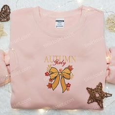 Autumn Girly Coquette Bow Embroidered Shirt As the leaves begin to paint the world in hues of crimson and gold, there’s no better time to envelop yourself in the cozy charm of autumn. Tinicloset invites you to experience the season’s magic through our exquisite collection of embroidered sweatshirts, T-shirts, and hoodies. Our Autumn Girly Coquette... Cute Floral Embroidery Fall Tops, Holiday Embroidered Tops For Fall, Cute Custom Embroidered Tops For Fall, Cute Tops With Custom Embroidery For Fall, Pink Top As Gift For Fall, Pink Top As Fall Gift, Pink Custom Embroidered Tops For Fall, Pink Tops With Custom Embroidery For Fall, Halloween Embroidery Shirts