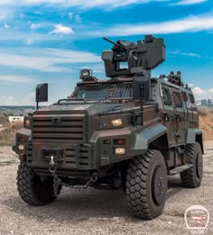 an armored vehicle parked in the middle of a field