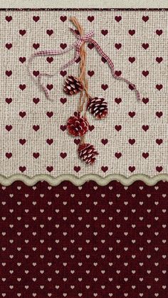 a piece of fabric with hearts and pine cones on it