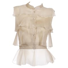 This is a luxurious 2000s sleeveless soft gold Valentino Garavani tiered sleeveless blouse with delicate semi sheer ruffles in an exquisite fine silk chiffon. Tailored to perfection, this top is a timeless piece that will elevate any wardrobe. There is a hook and eye closure at the bottom of the top and the tiers are finished with a rolled serged hem. The bottom layer is completely sheer and the top two are semi opaque. Labeled as a 6 and fits a size XS/S. Please use the measurements as a guide. Chic Prom Dresses, Valentino Silk, 2000s Tops, Blouse Casual Fashion, Organza Top, Muted Green, Ruffles Fashion, Elegant Blouses, Gold Silk