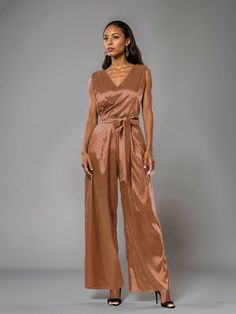 This soft satin jumpsuit features a flattering v-neck design, making it the perfect choice for mothers of the bride. Its dress pantsuit style provides comfort and elegance, while its high-quality material ensures a polished look. Stay stylish and comfortable on that special day with our jumpsuit. Chic Satin V-neck Jumpsuits And Rompers, Elegant Fitted Jumpsuits And Rompers With Surplice Neckline, Elegant Party Jumpsuits And Rompers With Surplice Neckline, Elegant Party Jumpsuit With Surplice Neckline, Elegant V-neck Spring Pantsuit, Elegant Satin Pantsuit For Evening, Elegant V-neck Evening Pantsuit, Elegant Satin Jumpsuits And Rompers For Workwear, Chic Formal Satin Jumpsuits And Rompers