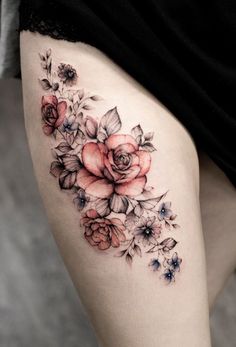 a woman's thigh with flowers on it