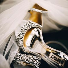 the bride's wedding shoes and veil are on display