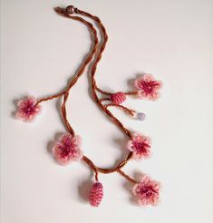 The one of a kind asymmetrical beaded cherry blossom necklace, 100% designed and hand-crafted by me! This 40 cm unique, artisan jewelry is meant to look exactly like the magnificent spring cherry blossom branches so you can wear one on your neck and look like an ethereal nymph! It is entirely made with premium quality miyuki glass beads that they are known to made exclusively in Japan and are considered one of the most refined, luxurious tiny beads in the world! You will not wear a simple neckla Handmade Whimsical Choker Jewelry, Handmade Whimsical Choker Necklace, Whimsical Handmade Choker Necklace, Handmade Pink Choker As A Gift, Handmade Pink Choker As Gift, Pink Beaded Necklace With Flower Pendant, Handmade Delicate Beaded Necklaces With Round Beads, Delicate Handmade Beaded Necklaces With Round Beads, Pink Flower Pendant Necklace For Jewelry Making