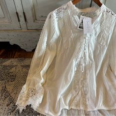 We Are Obsessed With This Boho Vintage Style Blouse. This Pretty Blouse Features A Soft White Cotton Base, Button Front, Crochet Lace Details And Feminine Slim Fit. + Well Made + True To Size - Slim Fit + Heather Is 5'8" / 140 Lbs And Modeling A Size Medium + Soft Cotton Blend Approx. Measurements: Small: Pit To Pit: 18", Length: 22.5" Medium: Pit To Pit: 19", Length: 23" Large: Pit To Pit: 20", Length: 23" Xl: Pit To Pit: 22", Length: 24" ** Double Pit To Pit For Total Bust If You Love Free Peo White Bohemian Blouse With Button Closure, Bohemian Blouse With 3/4 Sleeves For Daywear, Photoshoot Cottagecore, Vintage Lace Blouses, White V-neck Bohemian Lace Top, Vintage Style Blouses, Bohemian V-neck Lace Trim Top, Bohemian Blouse With Lace Trim And 3/4 Sleeves, Embroidered Bohemian Off-white Blouse