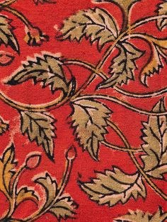 an image of a red background with leaves