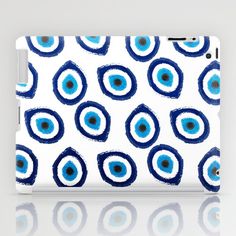 an ipad case with blue and white circles on it