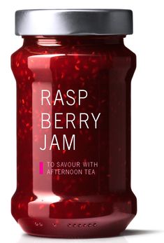 rasp berry jam in a glass jar on a white background with the words rasp berry jam