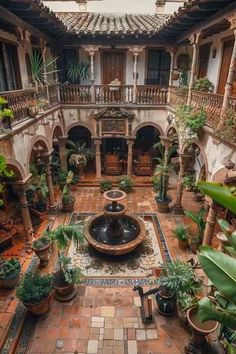 an indoor courtyard is shown with potted plants