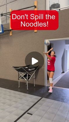 a woman in red shirt throwing a volleyball