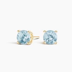 Solitaire Aquamarine Stud Ears - 14K Yellow Gold. These classic and stylish earrings feature serene blue aquamarines secured in classic four-prong basket settings with comfortable push back posts for pierced ears. Aquamarine Earrings Studs, Aqua Earrings, Aquamarine Studs, Yellow Gold Solitaire, Stylish Earrings, Aquamarine Earrings, Opal Earrings Stud, Opal Studs, Stylish Earring