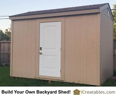 a tan shed with a white door and brown roof