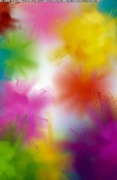 multicolored paint splattered in the air and on top of each other