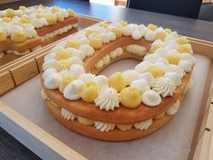 there is a cake with white and yellow decorations on it