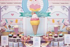 an ice cream parlor filled with lots of cupcakes and desserts on display