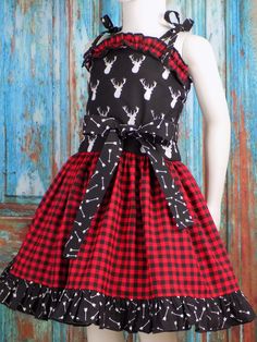 "Girls Red and Black Gingham Dress is perfect for School or a trip to the Rodeo. Hunting Pageant Dress, Western Wear, OOC for Babies and Toddlers. Cute Stag Dress with Black and White Arrows. My Boutique Dresses are Handmade with all Cotton fabric. Handmade Made in the USA by me! Dress shown is a 5T with a Tutu underneath that is Not Included **Please view Picture 10 for Measurement Size Chart Order this semi fitted dress by \"Bodice Measurements\" All Measurements are Approximate Name: Red &amp Black Gingham Dress, Semi Fitted Dress, Girls Western Dresses, Dress Western, Usa Girls, Black Gingham, Pink Cowgirl, Girls Pink Dress, Girls Red