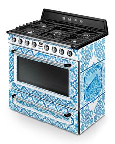 a blue and white stove top oven with an ornate design on the front, and two burners