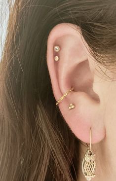 "This Petite Pyramid Titanium Conch Hoop is THE PERFECT minimalist conch hoop. It is dainty and delicate. And it *Sparkles* even without gems. These hoops are 16 guage, with diameter options available in 10,11 and 12 mm. Polished Titanium and PVD Gold are available. Color may vary due to differences in electronic screen settings. CUSTOM ANODIZING AVAILABLE Please message me if you would like a custom color!! Prior to placing an order for a hoop, please know the hoop size that you need. Hoop size Everyday Internally Threaded Hoop Cartilage Earrings, Internally Threaded Small Hoop Piercings For Everyday, Tiny Gold Huggie Cartilage Earrings, Dainty Internally Threaded Small Hoop Piercings, Dainty Internally Threaded Hoop Piercings, Dainty Small Hoop Internally Threaded Piercings, Gold Internally Threaded Hoop Cartilage Earrings, Gold Hoop Cartilage Earrings Internally Threaded, Gold Small Hoop Piercings Internally Threaded