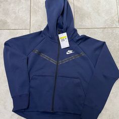 New With Tags Affordable Navy Nike Tops, Nike Tech Fleece Colors, Nike Tech Bleu Marine, Blue Sportswear Hoodie With Adjustable Hood, Sportswear Blue Hoodie With Adjustable Hood, Blue Fleece Sportswear Hoodie, Blue Fleece Hoodie Sportswear, Blue Sporty Hooded Sweatshirt, Blue Sportswear Hoodie With Double-lined Hood