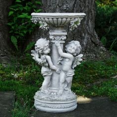 Bring beautiful birds to your yard and enjoy watching them in this decorative bird bath. Not only does it brings birds to the yard but also attracts butterflies dragonflies and many other delightful creatures in for a drink and a splash. The two cherub angels dancing around the pedestal add a touch of grace to this birdbath as well. This birdbath will certainly add some pizzazz to your patio or landscape. Product Features: Features two charming cherub angels on the base Intricate design on the basin including grapevines with grapes Pedestal has a roman-inspired design Bird bath features hints of green for a realistic look No assembly required comes in 1 piece Perfect for outdoor usage can be used indoors Dimensions: 19.25"H x 11"W x 11"D Depth of bowl: 1.75" Material(s): polyresin | Northl Bath Outdoor, Angel Garden Statues, Angel Garden, Ladybug Garden, Outdoor Garden Statues, Garden Angels, Garden Statue, Outdoor Statues, Outdoor Sculpture