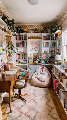 a room filled with lots of books and furniture