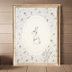 a rabbit is sitting in the middle of a frame