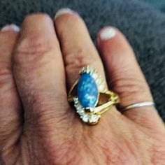 Beautiful Ring, Simulating A Fire Opal. Also Cubic Zirconia Stones. Gold Plate With Unknown Metals, Size 7.5 Please Let Me Know If You Have Any Questions Blue Opal Ring With Accent Stones, Elegant Blue Opal Ring, Fire Opal Ring, 5 Rings, Ring Color, Opal Ring, Beautiful Ring, A Fire, Opal Rings