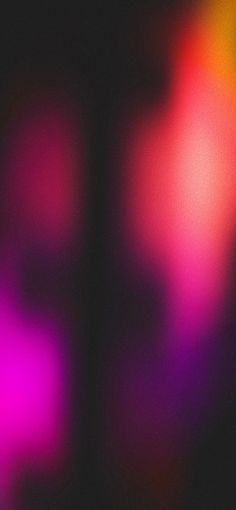 blurry image of pink and purple colors on black background