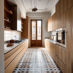 a kitchen with wooden cabinets and tile flooring