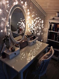 a desk with a mirror and some lights on it